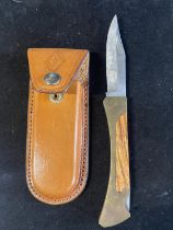 A foldable lock knife with leather case