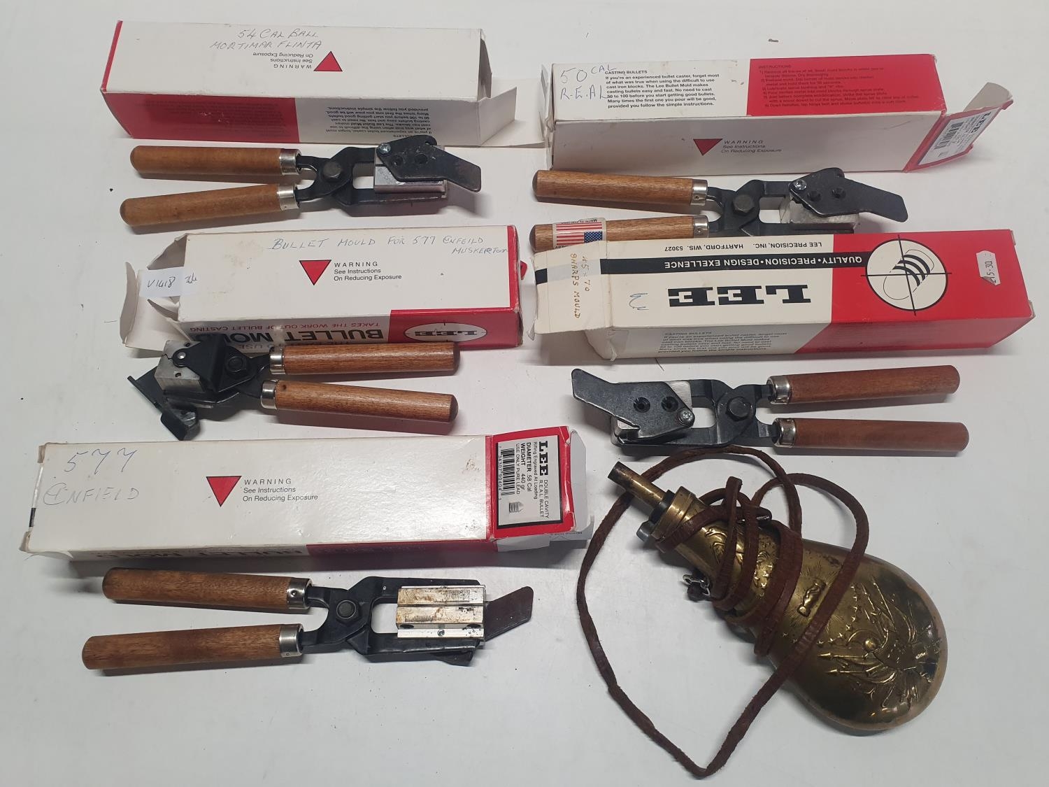 A selection of assorted calibre Lee bullet moulds and a reproduction American Civil War period