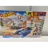 A boxed Hot Wheels advent calendar (8 cars and 16 accessories)