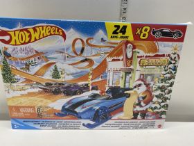 A boxed Hot Wheels advent calendar (8 cars and 16 accessories)