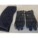 A pair of Riccha motorbike gloves and back brace