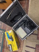 A boxed Dremel multi tool and a 150mm angle grinder (untested), shipping unavailable