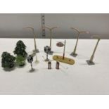 A bag of assorted vintage model road accessories including Dinky