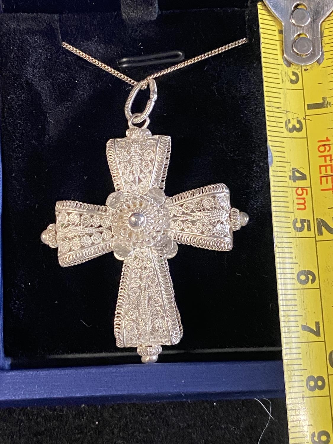 A white metal pendant on a 925 silver chain