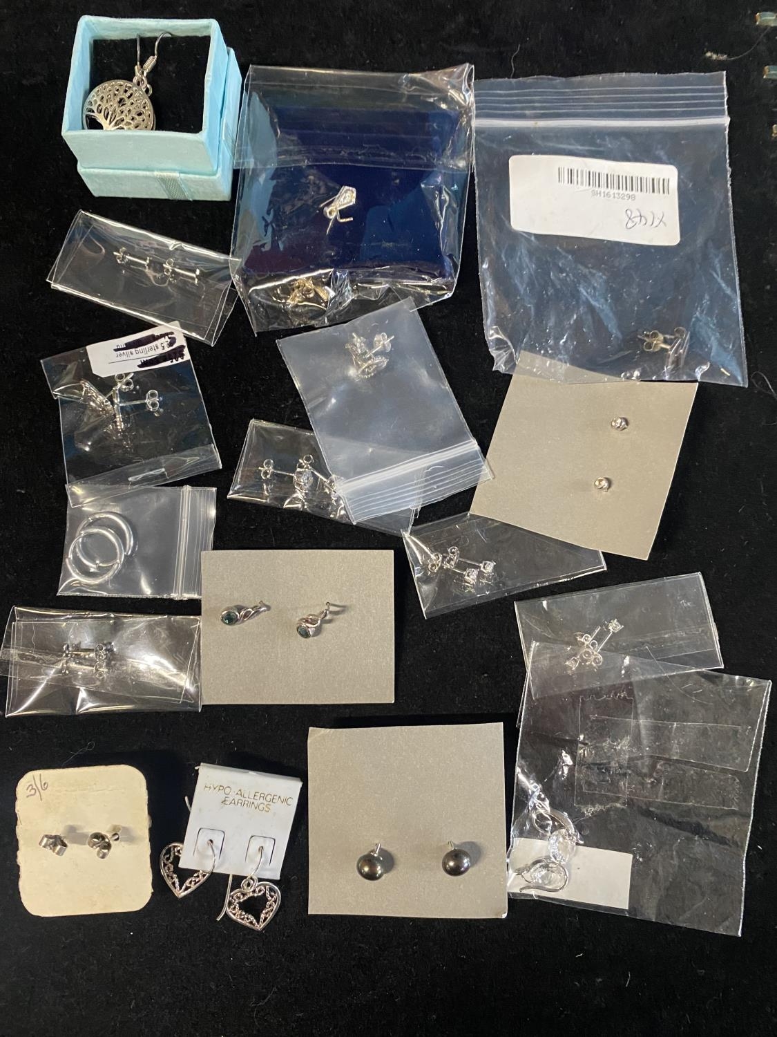 A selection of mostly new silver earrings