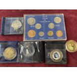 A selection of assorted commemorative coins and other