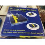 A boxed Diamond wheel tile cutter (unchecked) shipping unavailable