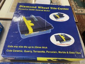A boxed Diamond wheel tile cutter (unchecked) shipping unavailable
