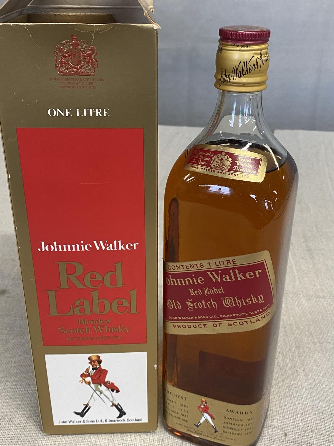 A bottle of 1 litre Jonny Walker red label whiskey, shipping unavailable