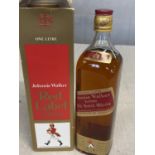 A bottle of 1 litre Jonny Walker red label whiskey, shipping unavailable