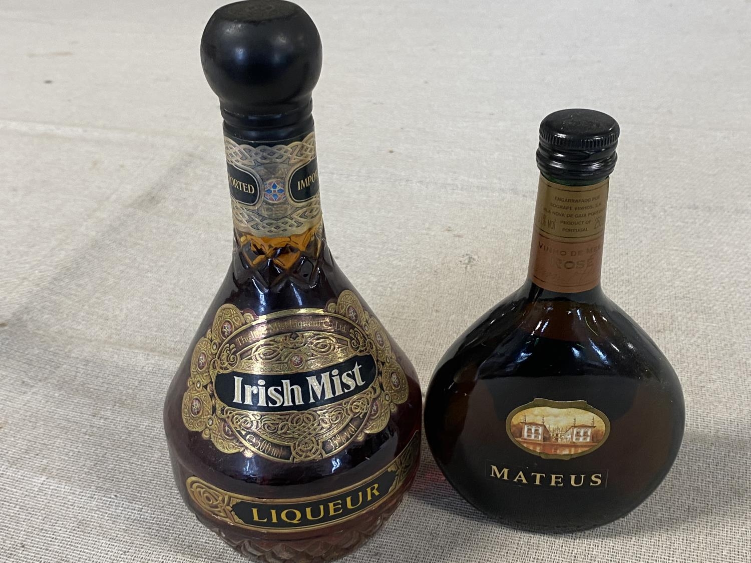 A sealed bottle of Irish Mist Liquor and small bottle Matatus rose, shipping unavailable