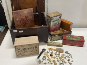 A wooden box full of vintage tins & other items. No shipping.