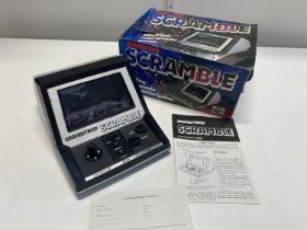 A boxed Grandstand scramble electronic game. (untested)