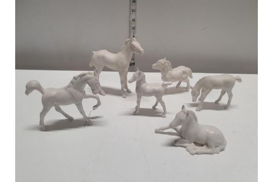 Six small Beswick white horses