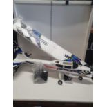 A boxed Discovery electric remote control model plane (unchecked), shipping unavailable