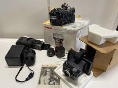 A selection of photographic equipment including cameras & lenses etc.