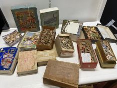 A large box of assorted mixed vintage and antique jigsaw puzzles