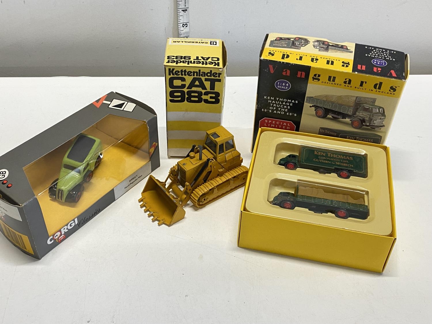 Three boxed die-cast models