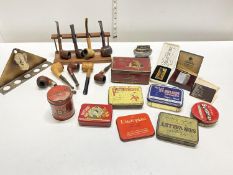 A job lot of smoking related ephemera including pipes and pipe racks