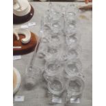 Twelve cut glass hot toddy glasses and glass ladle, shipping unavailable