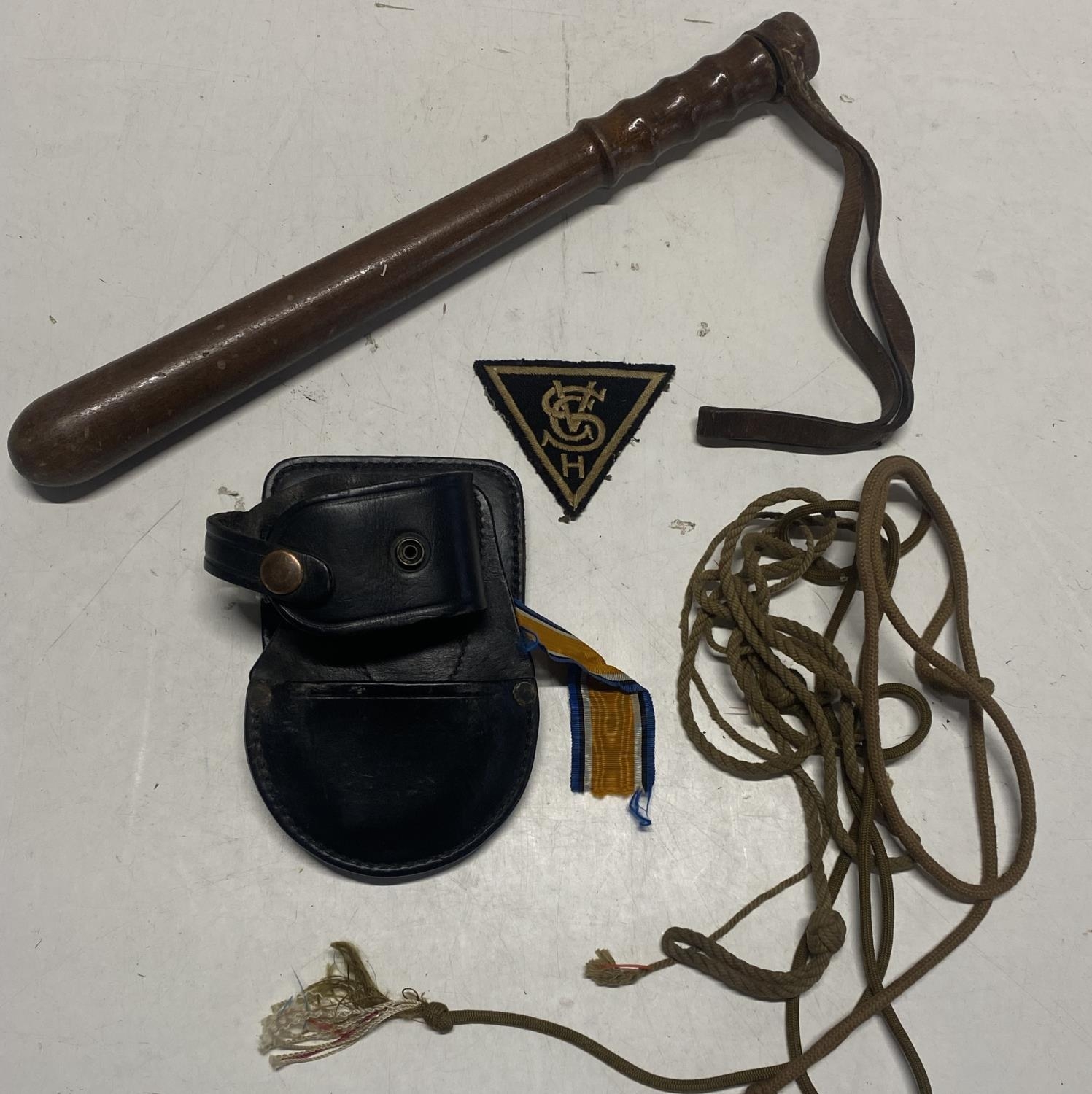 A vintage wooden truncheon and arm patch etc