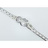 Armband mit kleinen Diamanten.  14 ct. WG. L 16 cm. 20 g