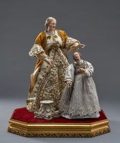 Mutter Anna und Maria als Figurinen. Köpfe, Arme und Beine aus bemalter Keramik. Prächtige Kleidung