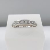 White gold full eternity ring set with 0.60 carats round brilliant-cut diamonds