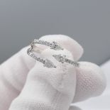 Striking white gold ""trident"" ring set with 0.40 carats pear and marquise cut diamonds