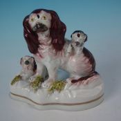 Staffordshire Pottery spaniel with playful pups