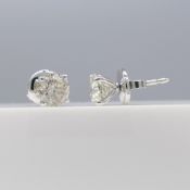 Pair of 18ct white gold solitaire ear studs set with 1.57 cts diamonds, boxed