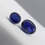 Two unmounted cabochon natural blue sapphire gemstones