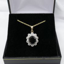 Black sapphire and diamond scalloped pendant and chain in yellow gold; with gift box