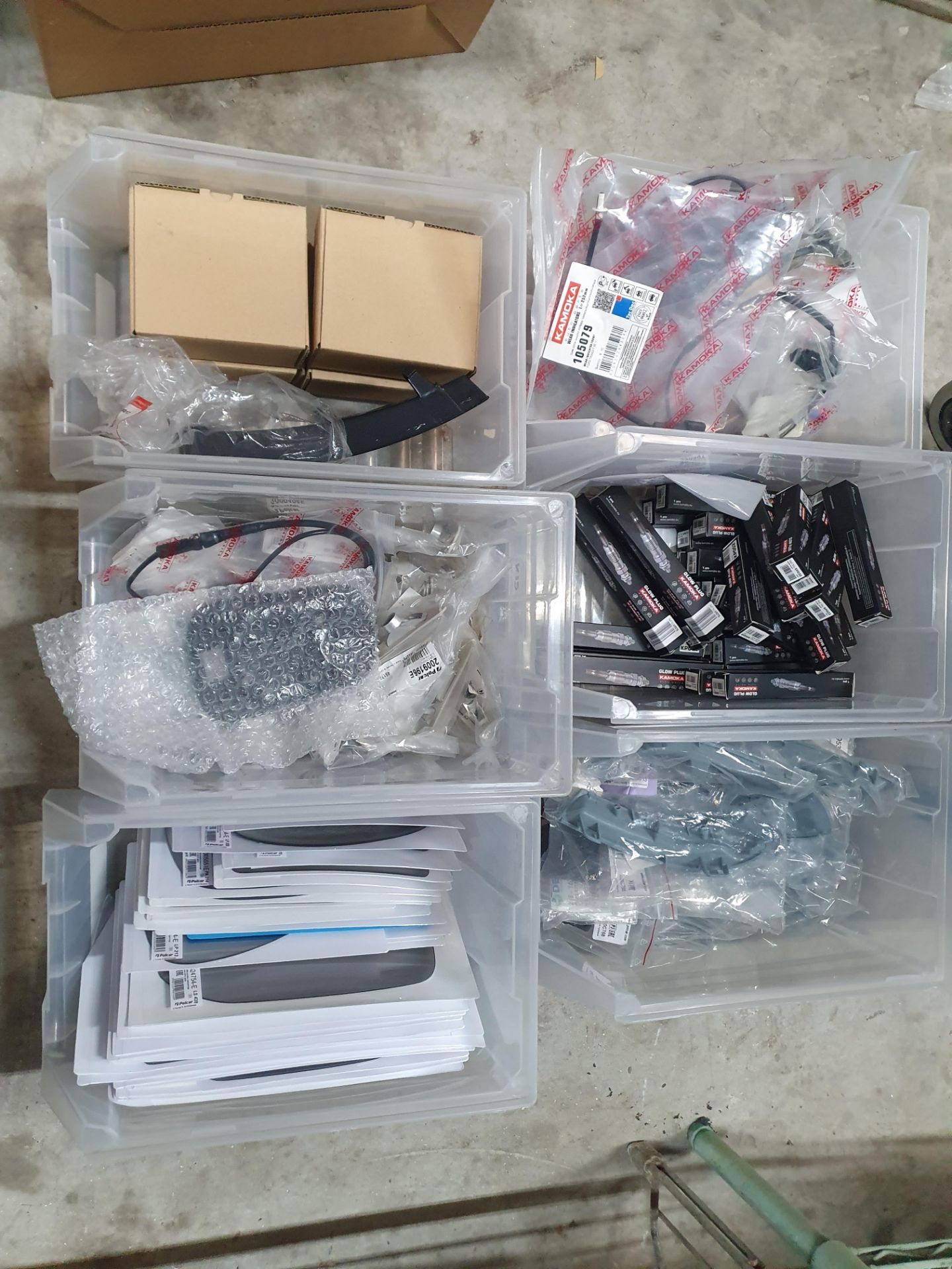 6 tubs with 110+ assorted items; glow plugs, door mirrors, indicators, etc