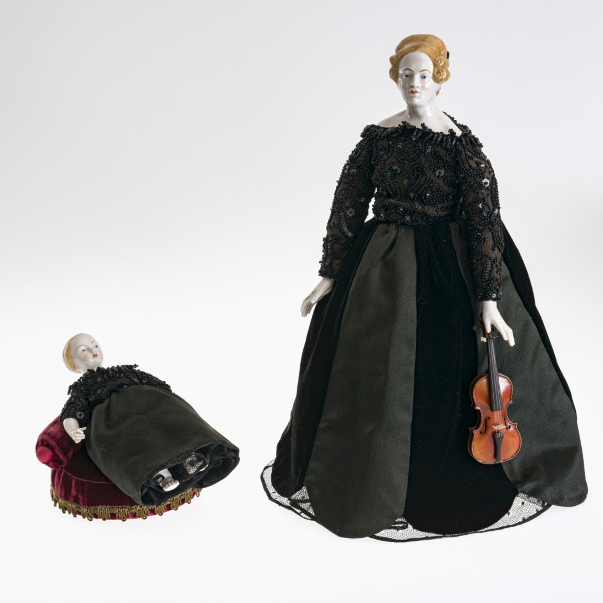 A doll (violinist) in ESCADA dress - Head, arms and legs from Nymphenburg, as of 1997. Later formati