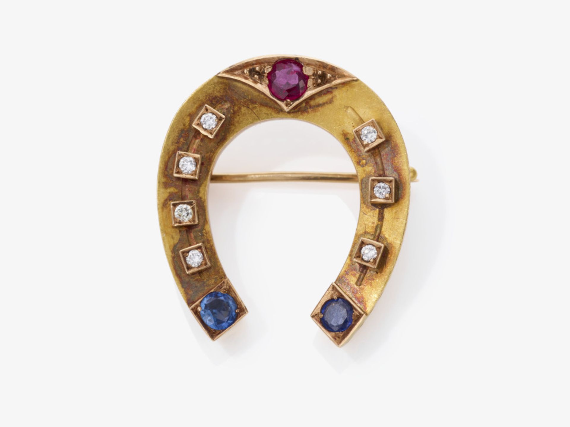 A horseshoe brooch with brilliant-cut diamonds, a ruby and sapphires - Russia, circa 1900