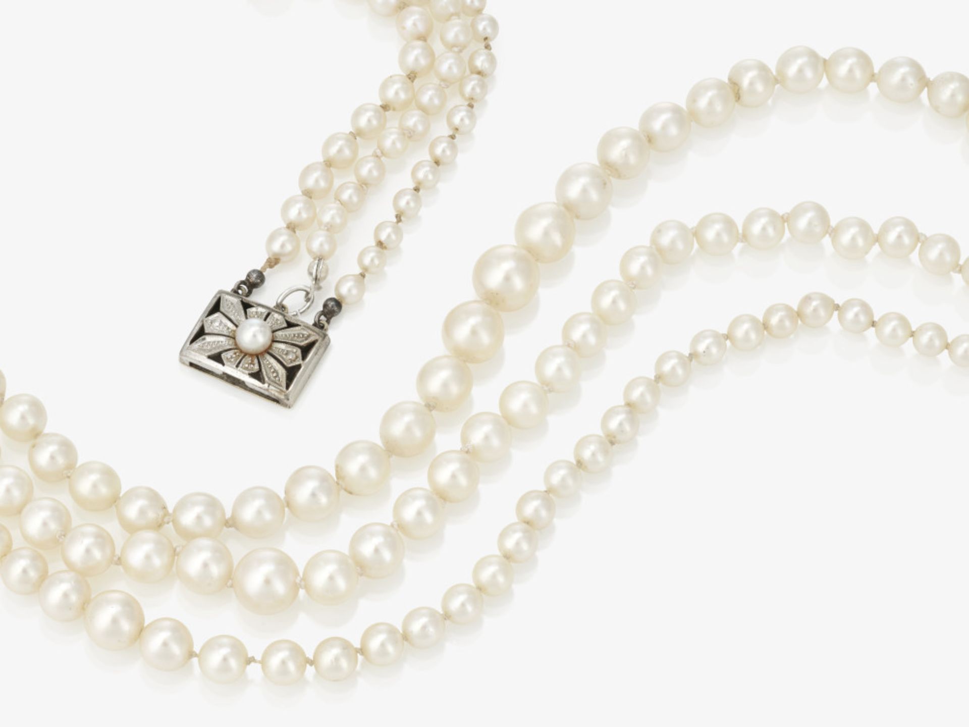 A three-strand cultured pearl necklace