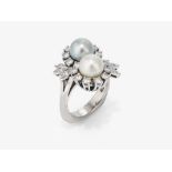 A ring with a white and grey cultured pearl and brilliant-cut diamonds - Germany, 1970s