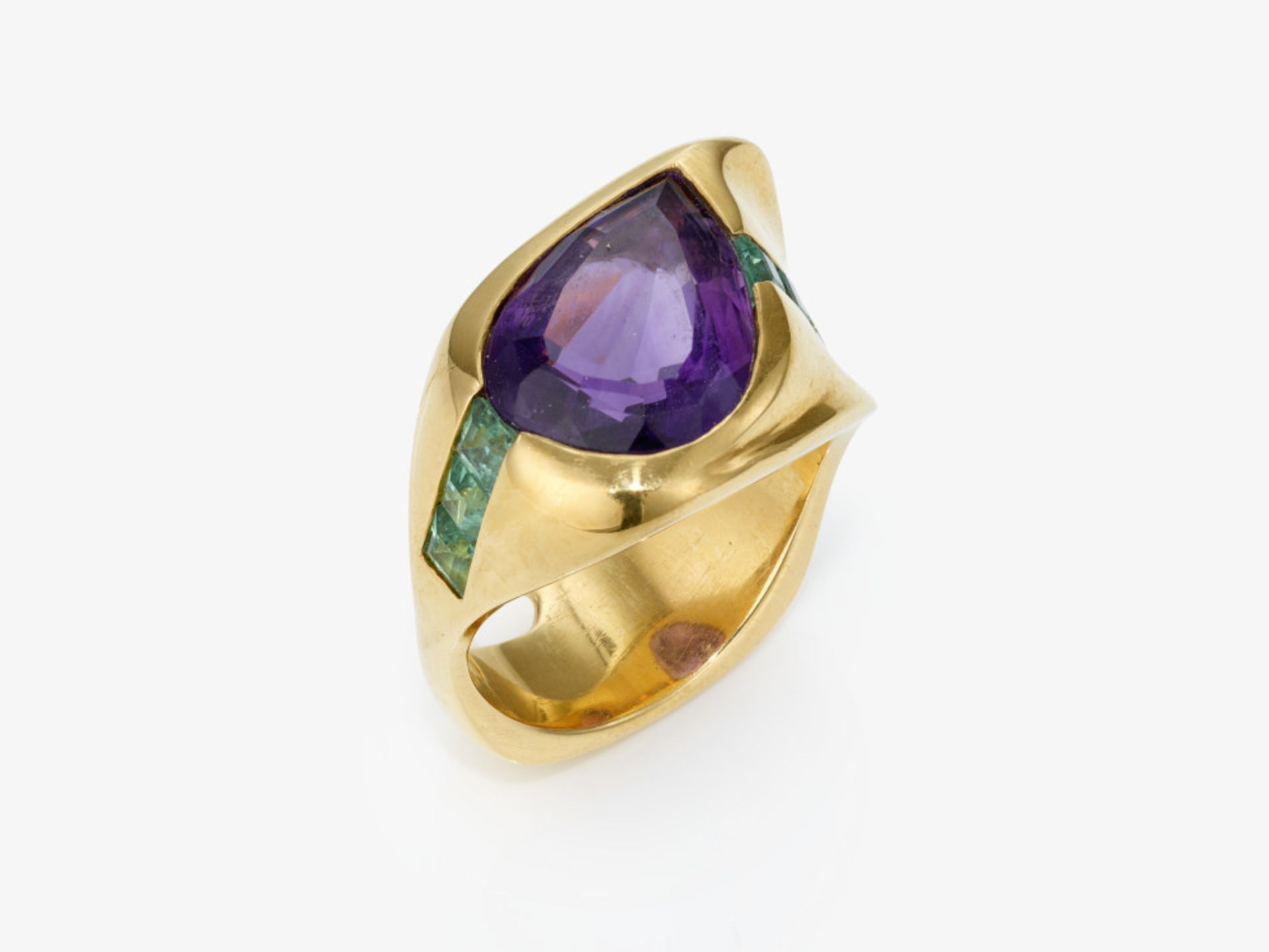 A ring with an amethyst and green-blue tourmalines