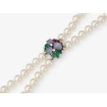 A two-strand Akoya cultured pearl necklace, clasp with fine star sapphires, brilliant-cut diamonds a