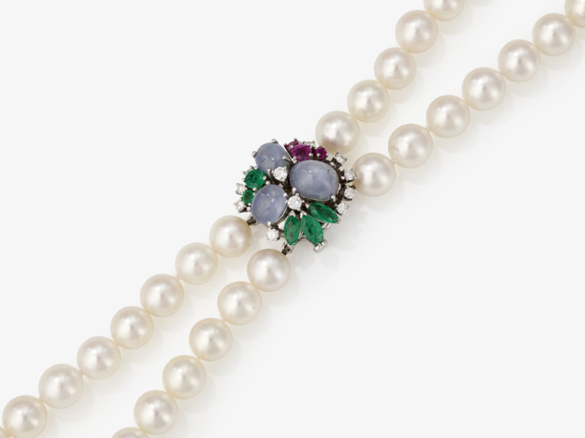 A two-strand Akoya cultured pearl necklace, clasp with fine star sapphires, brilliant-cut diamonds a
