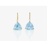 A pair of earrings with light blue topazes and brilliant-cut diamonds