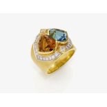 A ring with a cognac-coloured tourmaline and blue topaz