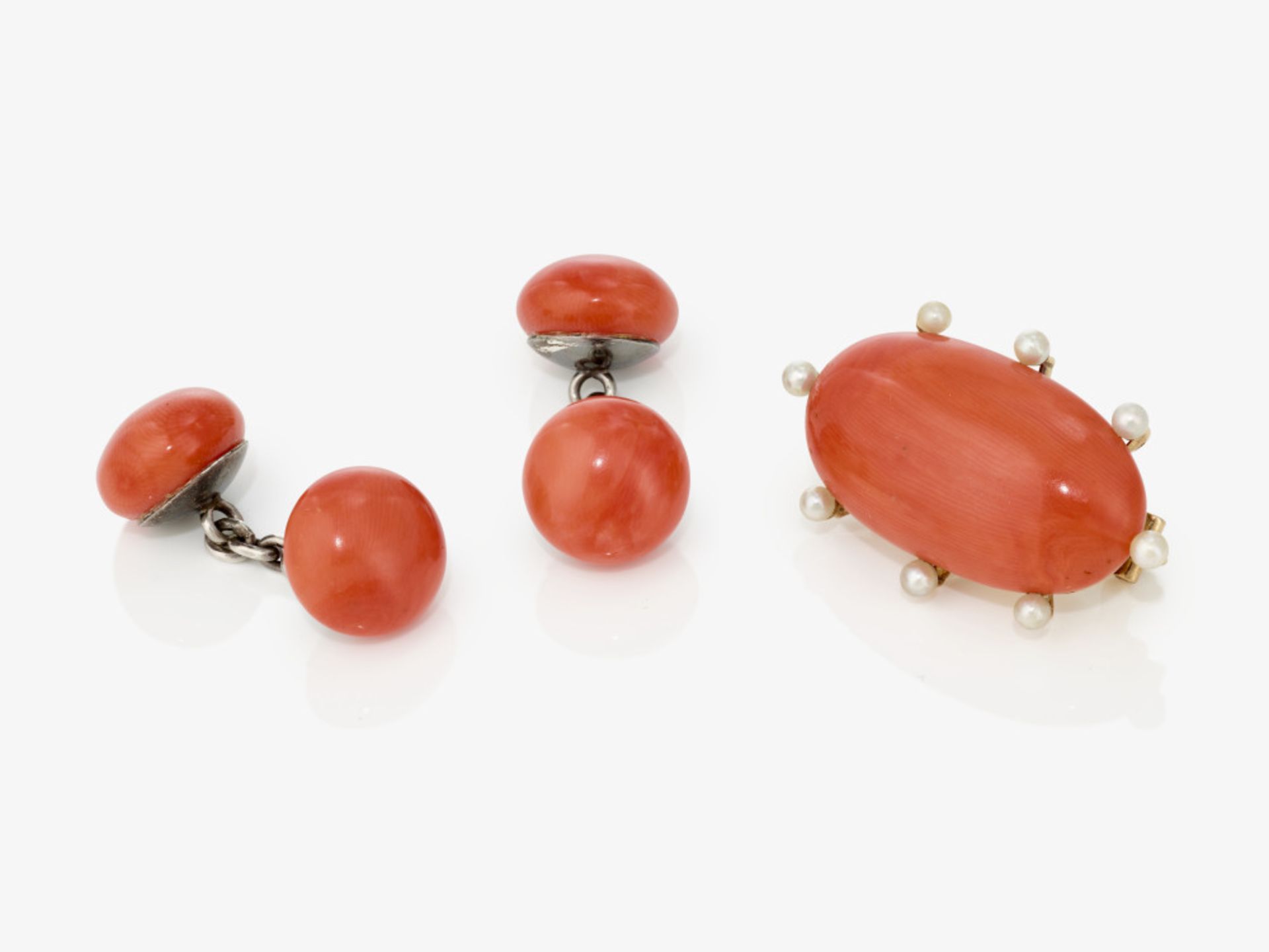 A coral brooch and a pair of coral cufflinks