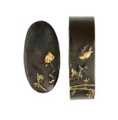 A JAPANESE IRON AND COPPER FUCHI-KASHIRA (COLLAR AND POMMEL)