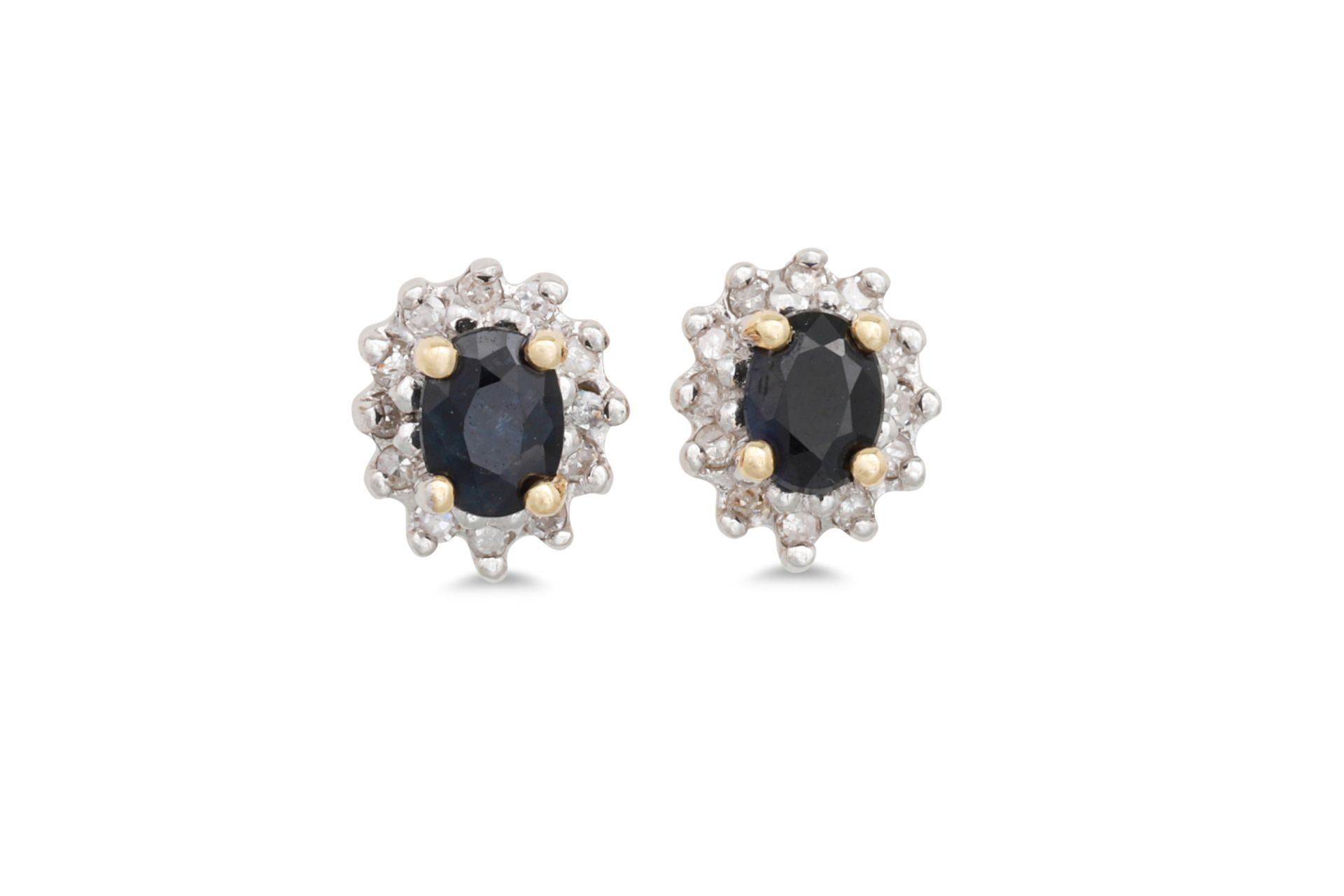 A PAIR OF DIAMOND AND SAPPHIRE CLUSTER EARRINGS, the circular sapphire to diamond surround,