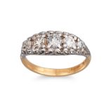 A FIVE STONE DIAMOND RING, the brilliant cut diamonds to a carved mounted in 18ct yellow gold.