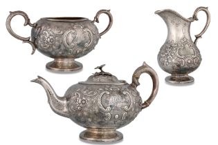 AN IMPRESSIVE VICTORIAN IRISH SILVER THREE PIECE TEA SERVICE, comprising a tea pot with matching