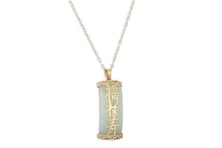 A CHINESE 9 CT GOLD & JADE PENDANT, on a chain