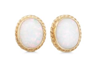 A PAIR OF OPAL EARRINGS, the oval opal to a gold surround